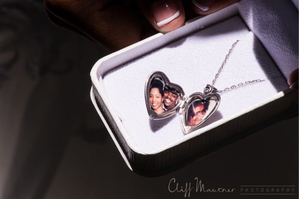 A heart shaped locket of the couple and beloved family member. 