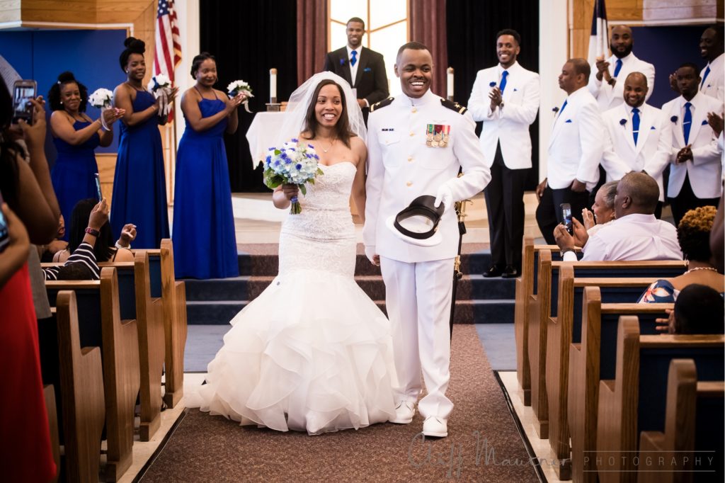 All smiles as the bride and groom walk down the aisle as officially husband and wife.